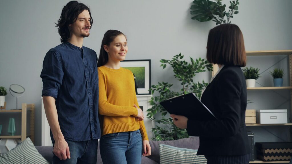 Home sellers meeting with a real estate agent before listing a home in Northern Virginia.